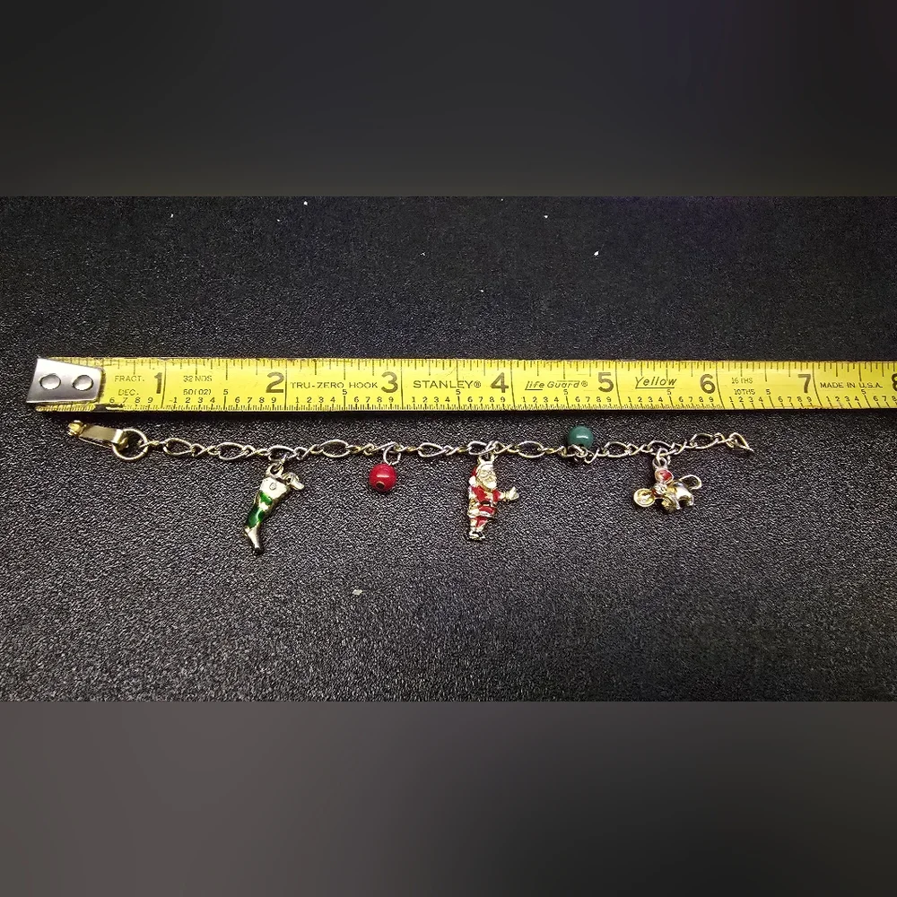Festive Gold Charm Bracelet with Santa and Colorful Accents